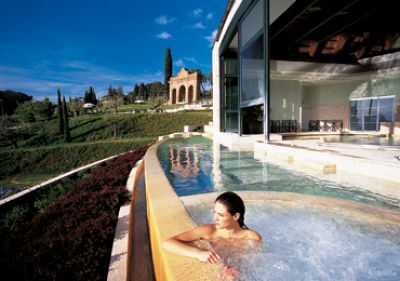 Client in hot water pool at Spa resort of Scan Casciano dei Bagni